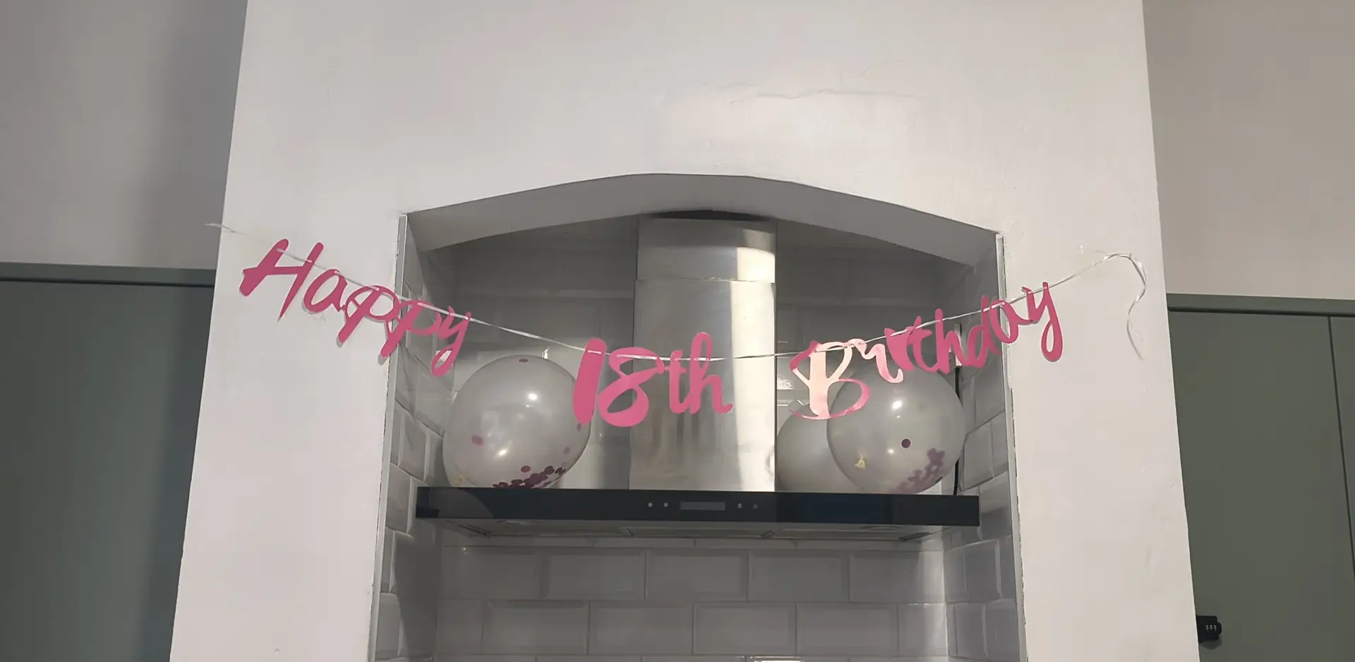 "Happy 18th Birthday" sign located in Enidaso House's kitchen.
