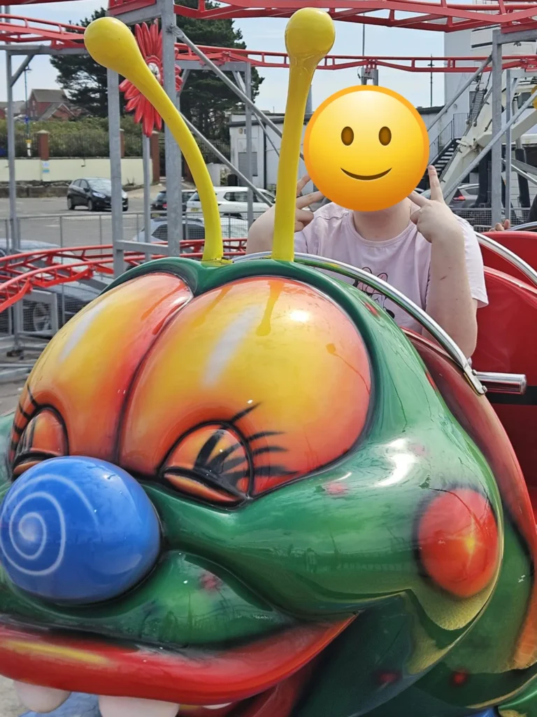 Enjoying rides at Barry Island including the Caterpillar ride.