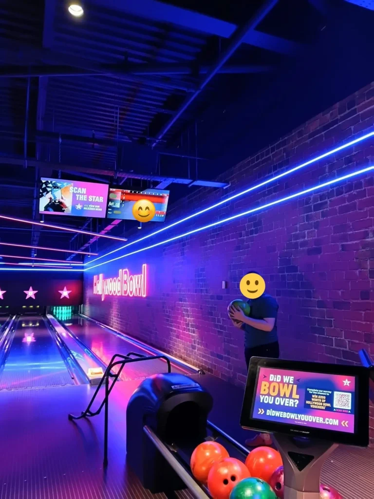 Young person participating in a bowling activity at a local bowling centre.
